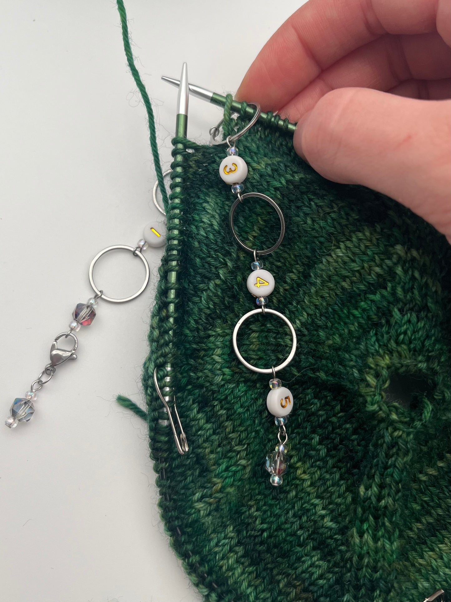 Reihenzähler 1-5 Facettperle mit großem Ring Silber